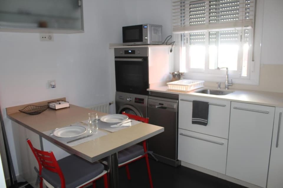 Kitchen or kitchenette, dishwasher, oven, stove