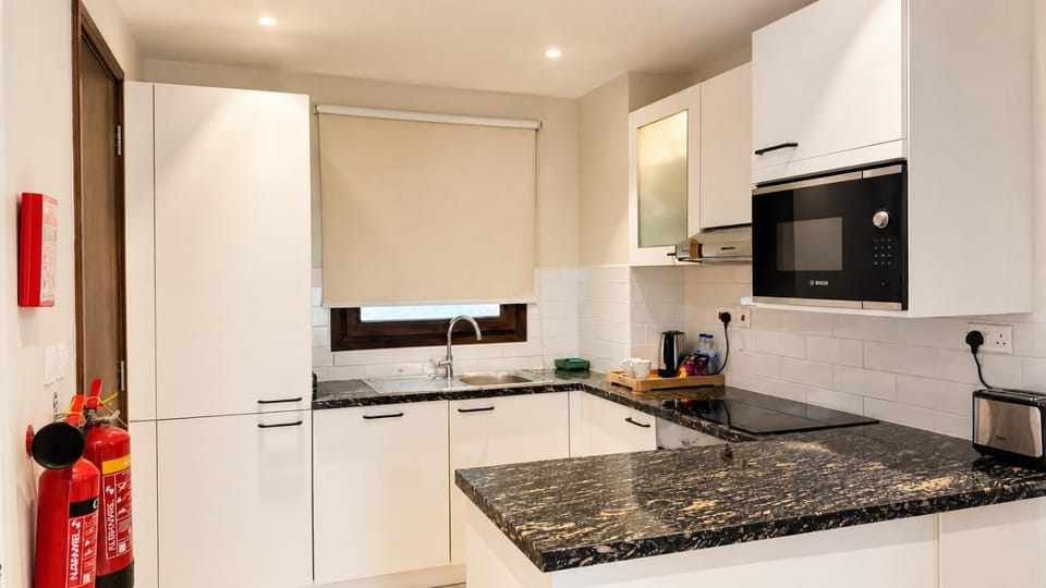 Kitchen or kitchenette, dishwasher, oven, stove, kitchen