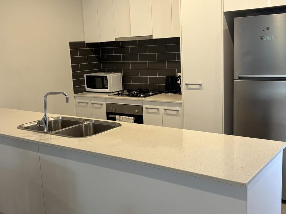 Kitchen or kitchenette, dishwasher, oven, stove, toaster