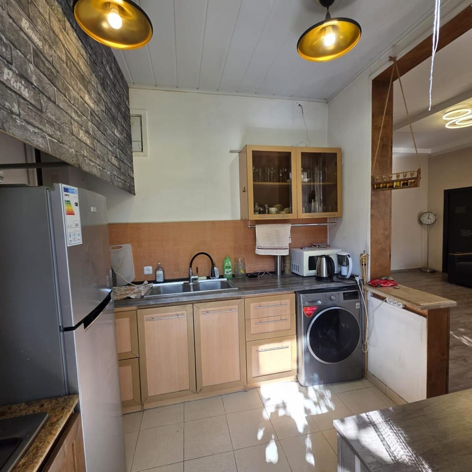 Kitchen or kitchenette, stove, washing machine