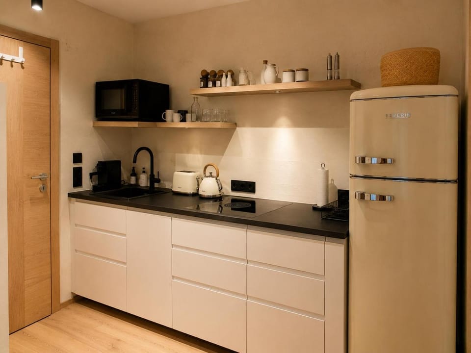 Kitchen or kitchenette, dishwasher, microwave, stove, toaster, kitchen