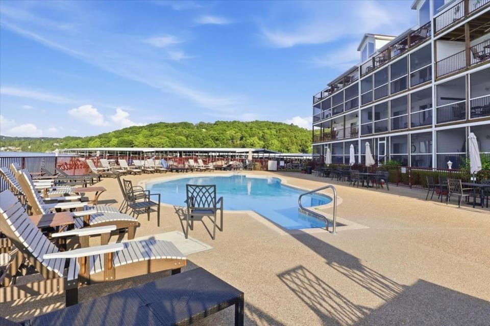 Property building, Day, View (from property/room), Lake view, Pool view, Swimming pool, Swimming pool, sunbed