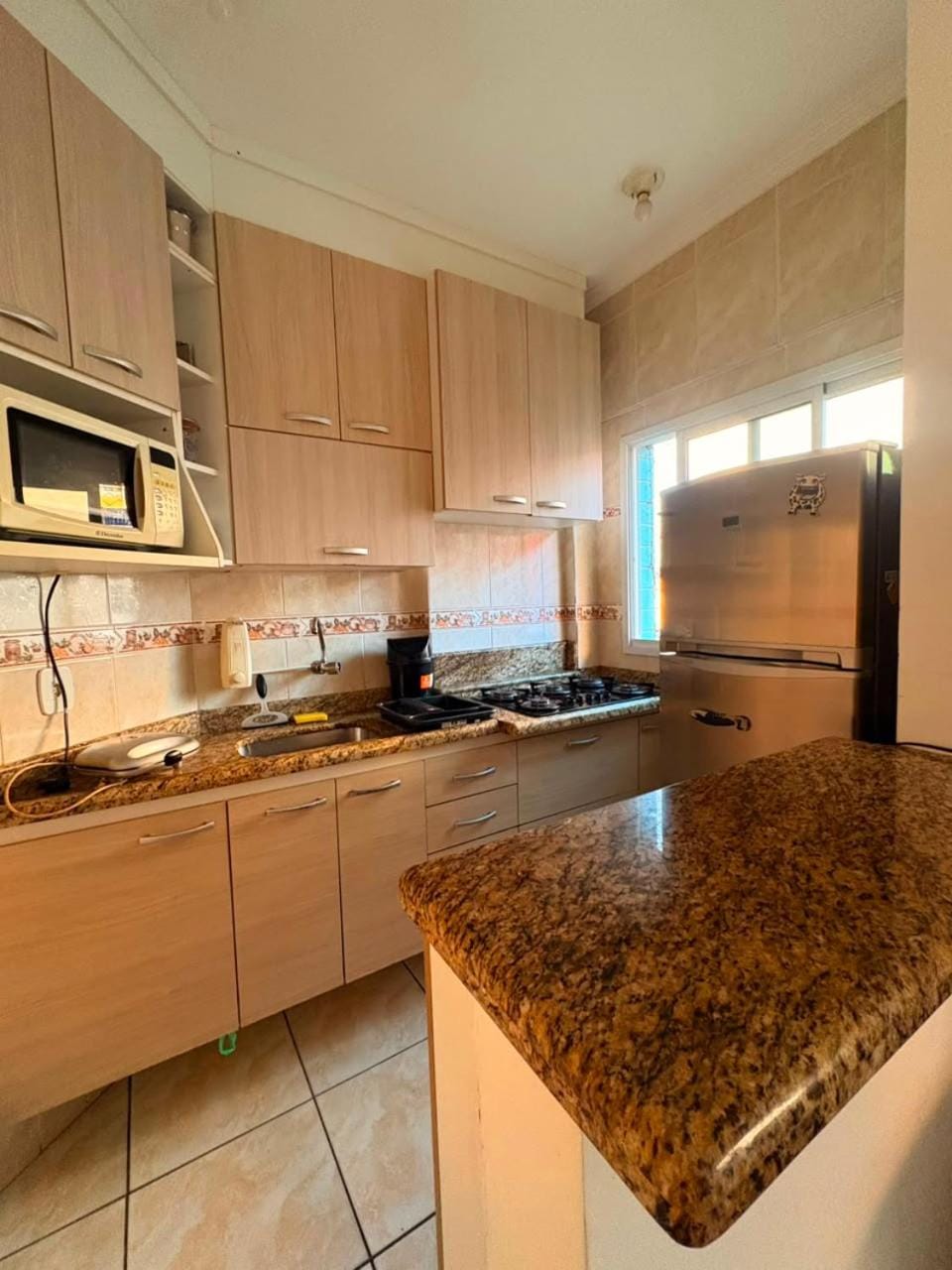Kitchen or kitchenette, microwave, stove
