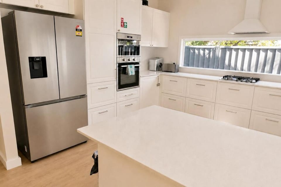 Kitchen or kitchenette, dishwasher, oven, stove