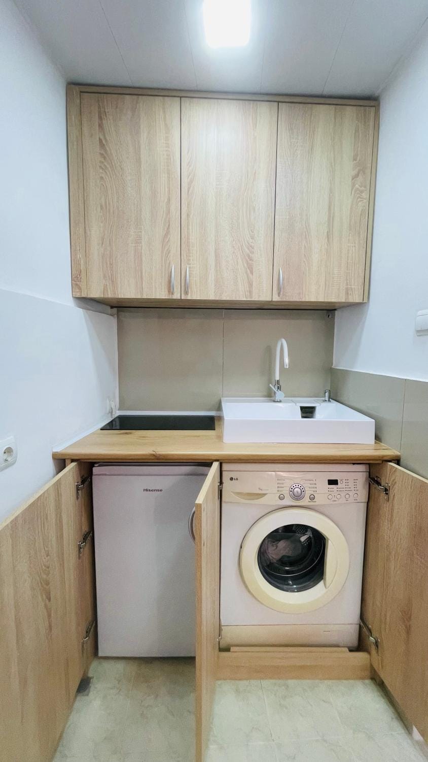 Kitchen or kitchenette, stove, washing machine