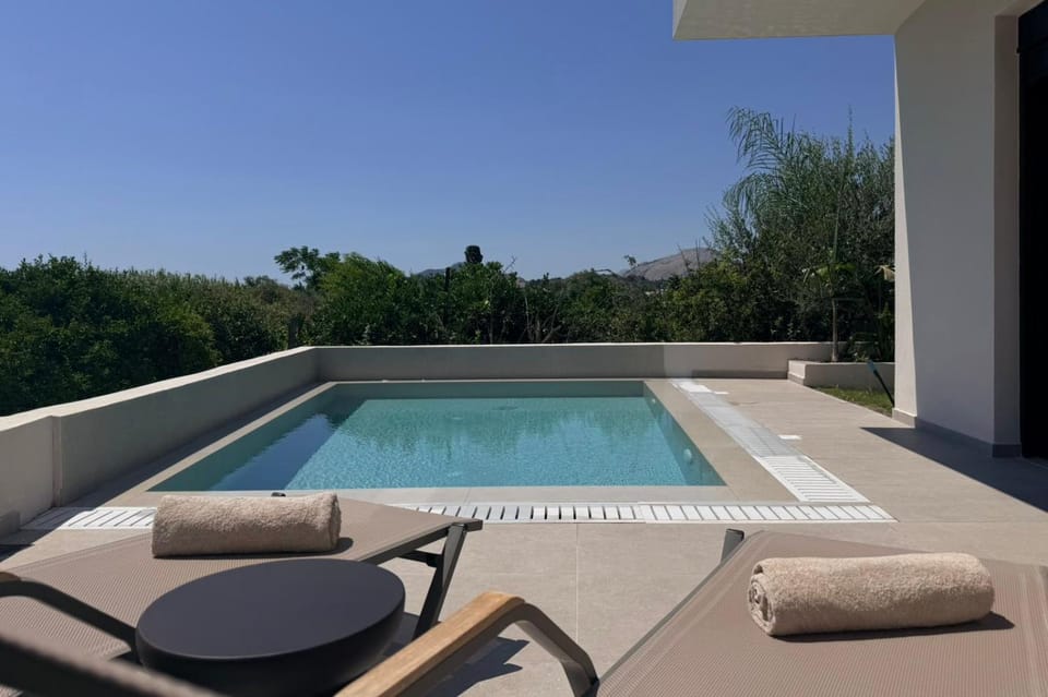 Patio, Day, Natural landscape, Pool view, Swimming pool, sunbed