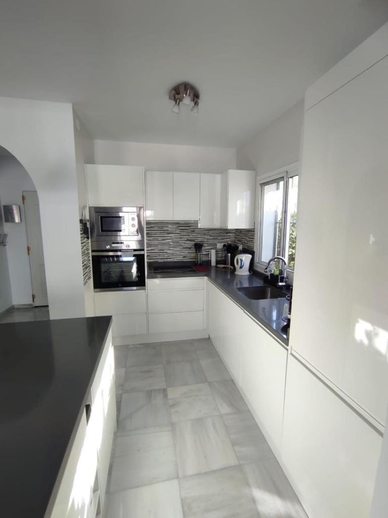 Kitchen or kitchenette, oven, stove