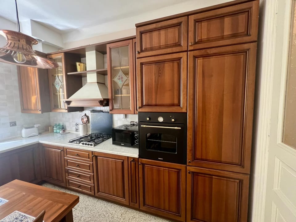 Kitchen or kitchenette, dishwasher, oven, stove