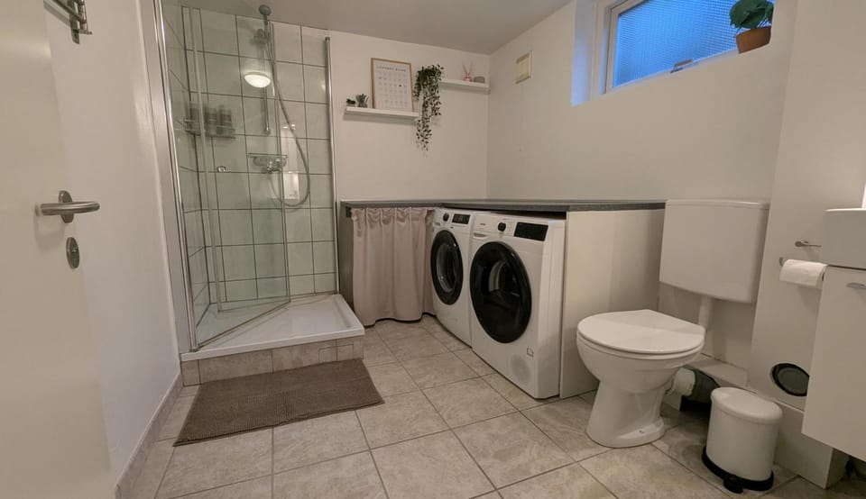 Shower, Toilet, Bathroom, towels, washing machine, dryer