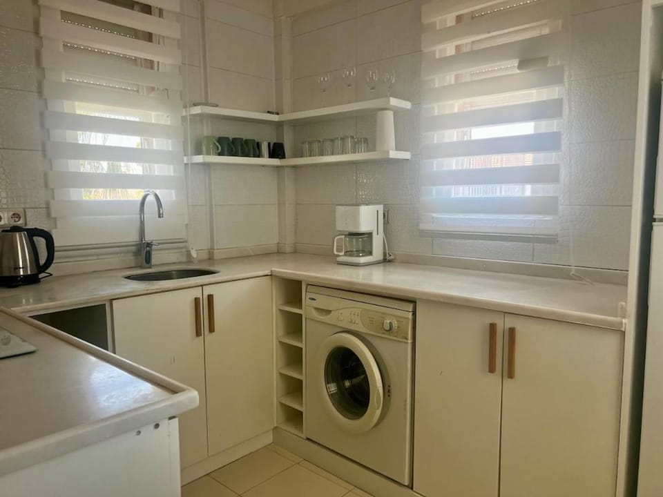 Kitchen or kitchenette, dishwasher, stove, washing machine