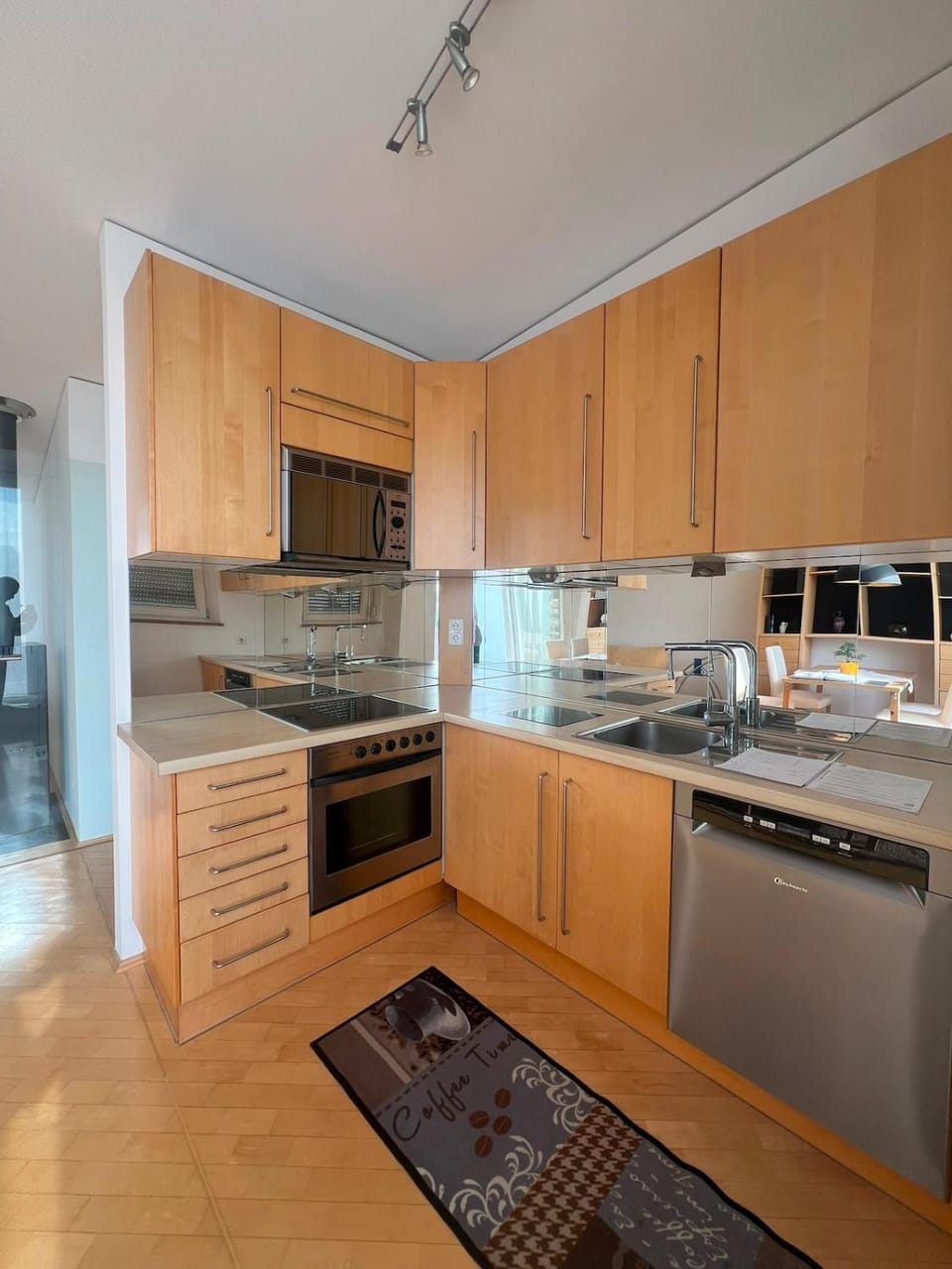 Kitchen or kitchenette, dishwasher, oven, stove