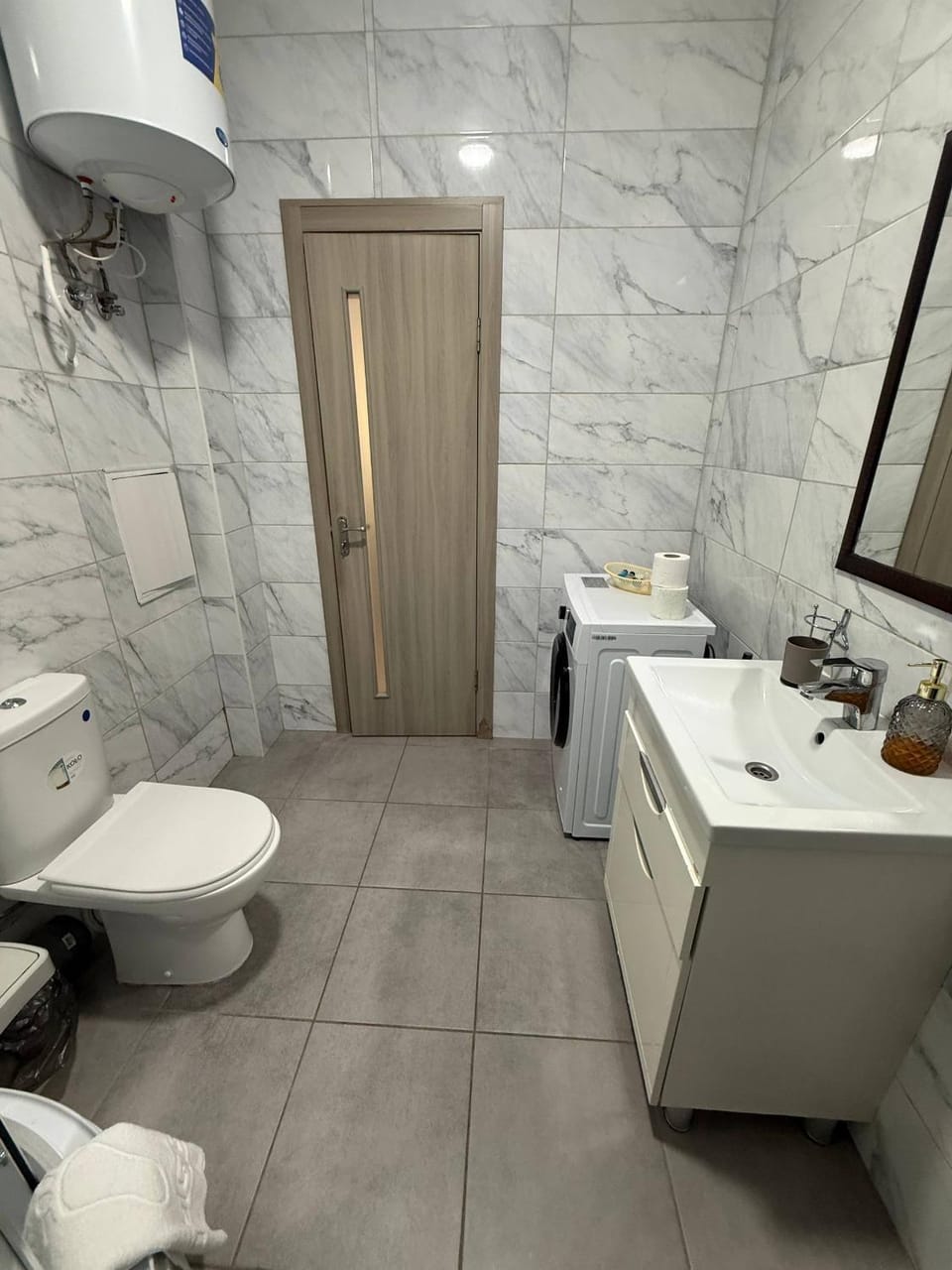 Shower, Toilet, towels, washing machine