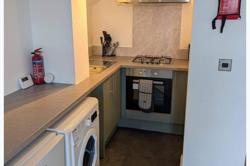 Kitchen or kitchenette, dishwasher, oven, dryer