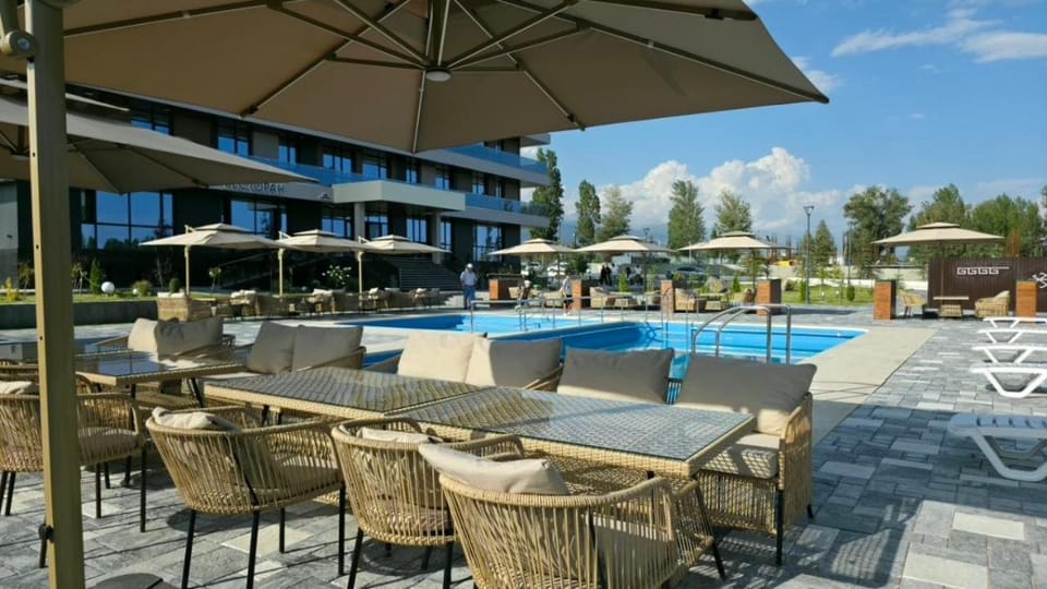 Property building, Patio, Natural landscape, Pool view, Swimming pool