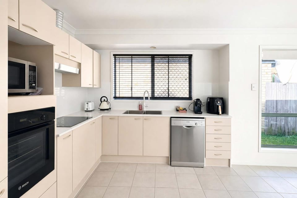Kitchen or kitchenette, dishwasher, oven, stove, toaster