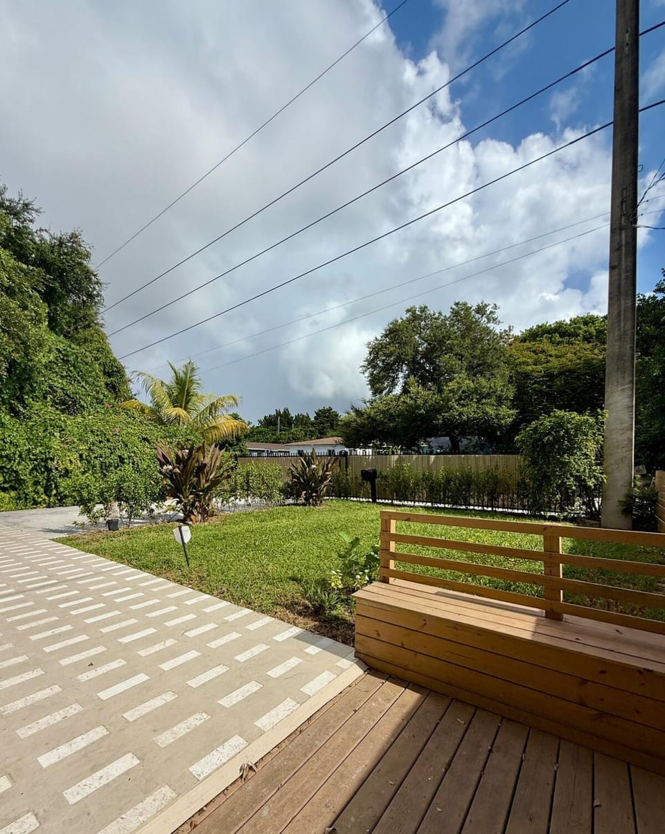 Private gated Miami home with oak tree deck House in Miami