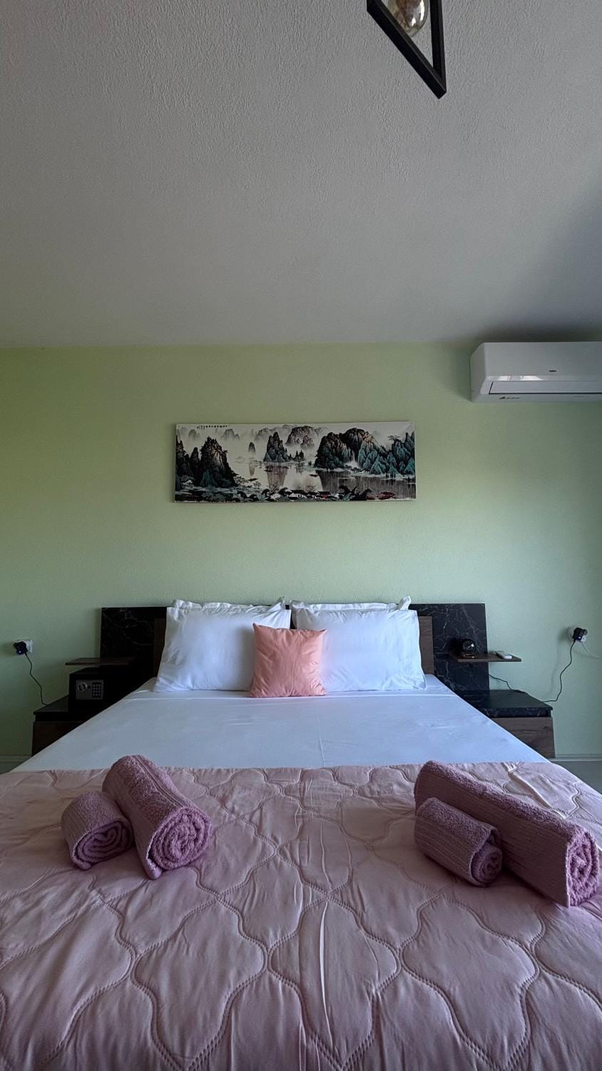Bed, Photo of the whole room, Bedroom, towels, air conditioner