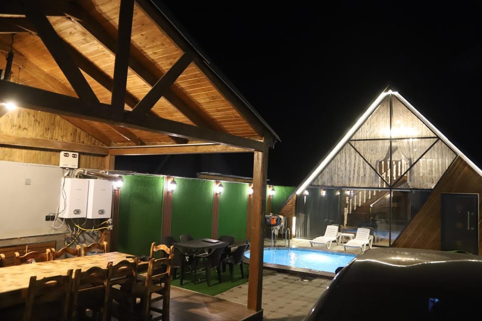 Patio, Night, Dining area, Pool view, Swimming pool, sunbed