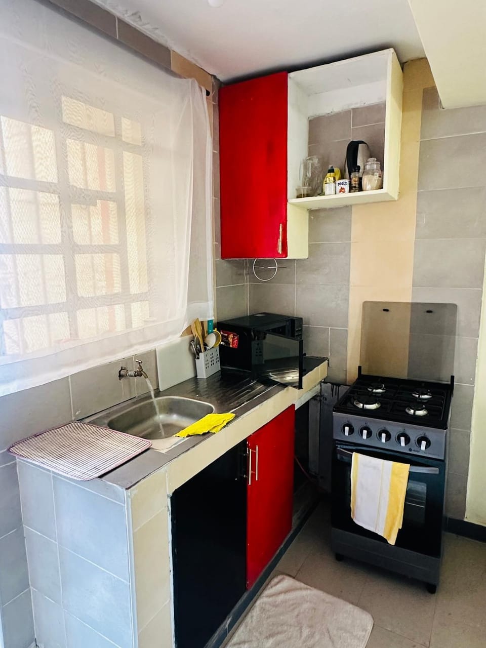 Kitchen or kitchenette, dishwasher, oven, stove