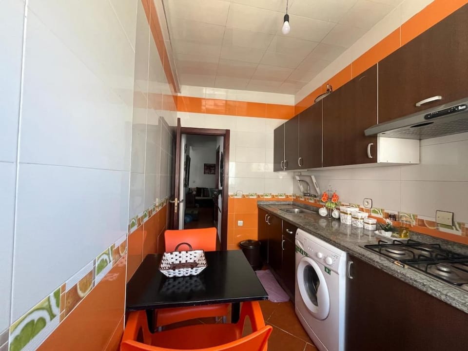 Kitchen or kitchenette, stove, washing machine