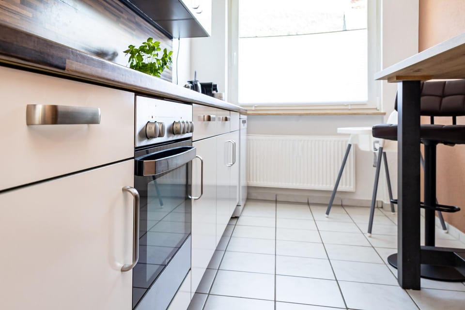 Kitchen or kitchenette, dishwasher, oven, stove, toaster