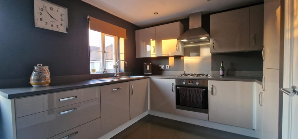 Kitchen or kitchenette, dishwasher, oven, stove