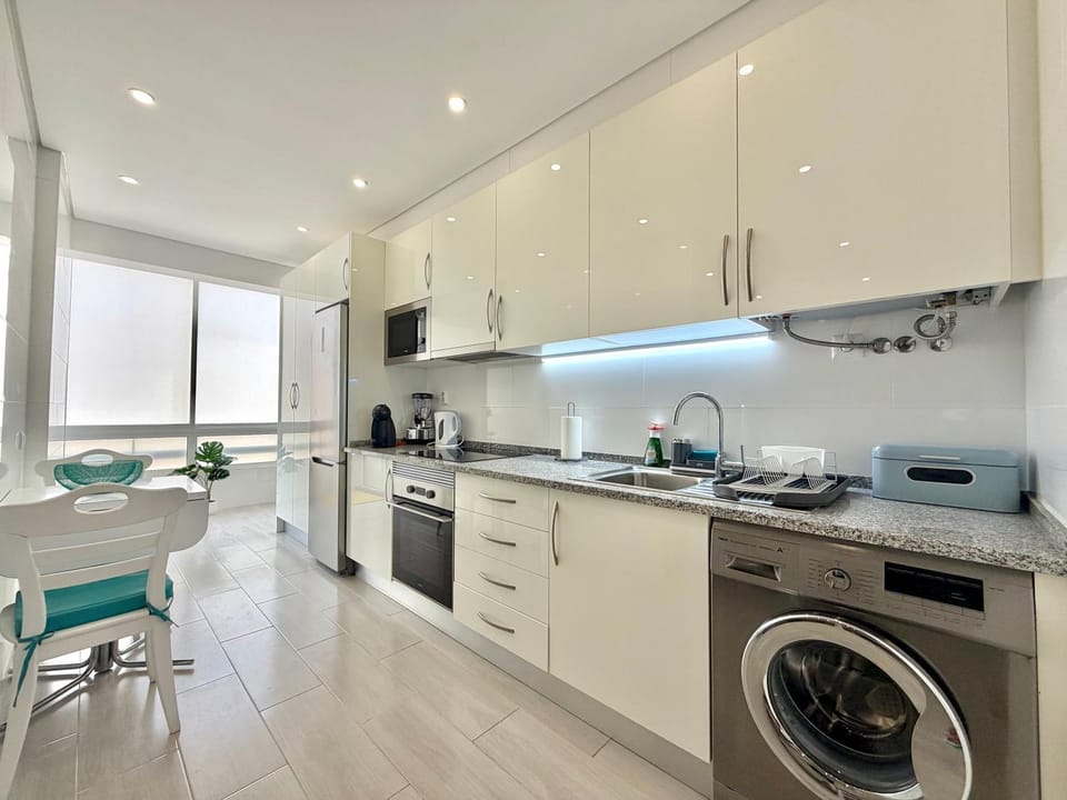 Kitchen or kitchenette, Dining area, oven, stove, toaster, washing machine
