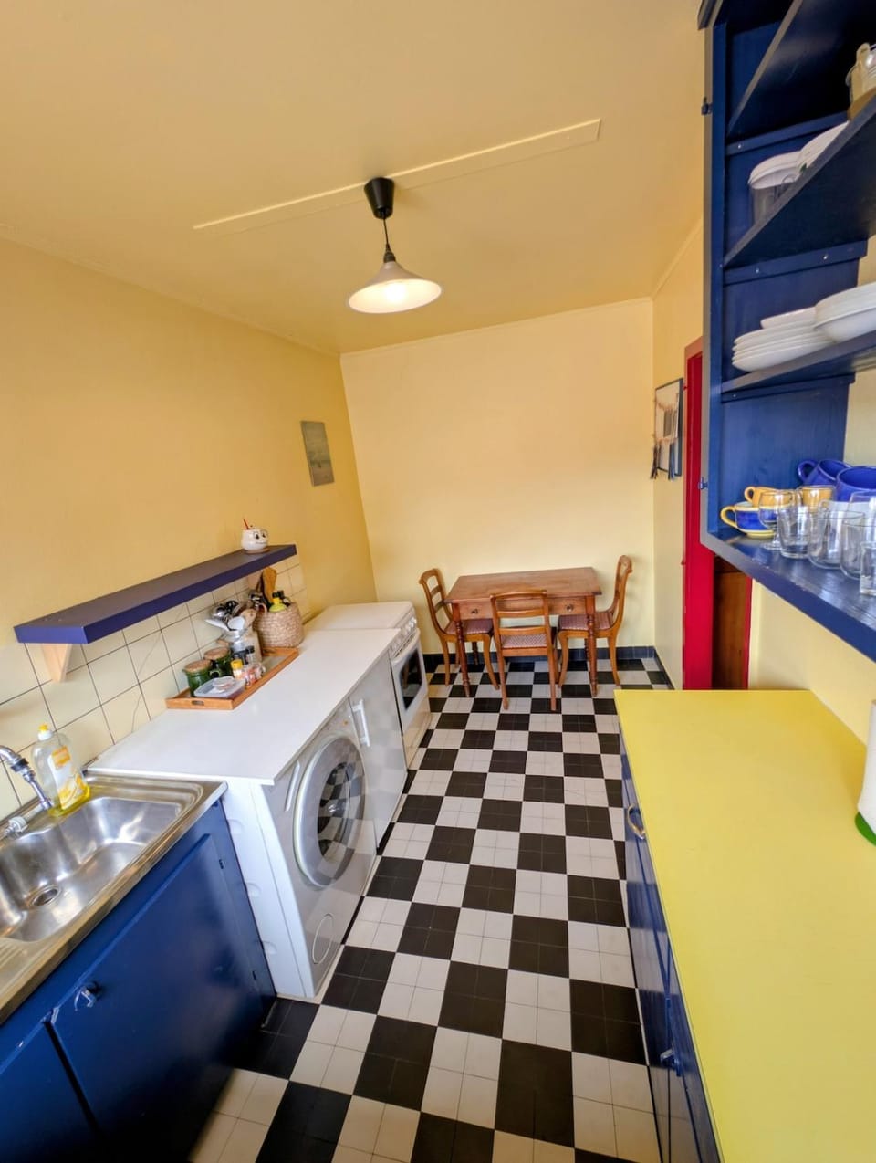 Kitchen or kitchenette, oven, stove, washing machine