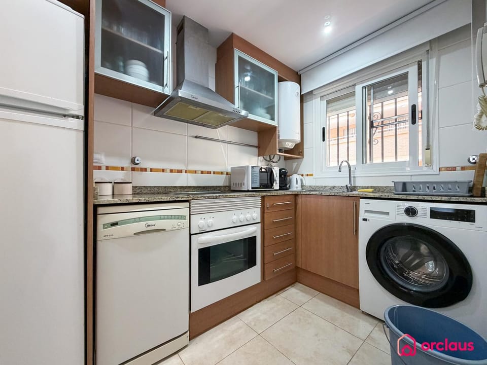 Kitchen or kitchenette, dishwasher, stove, washing machine