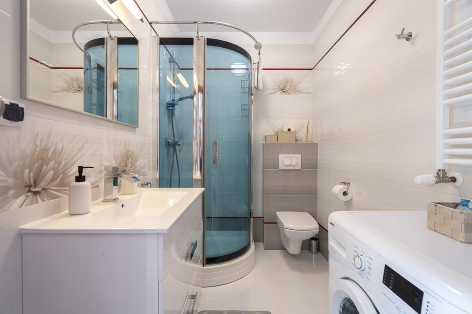Shower, Toilet, Bathroom, towels, washing machine, dryer