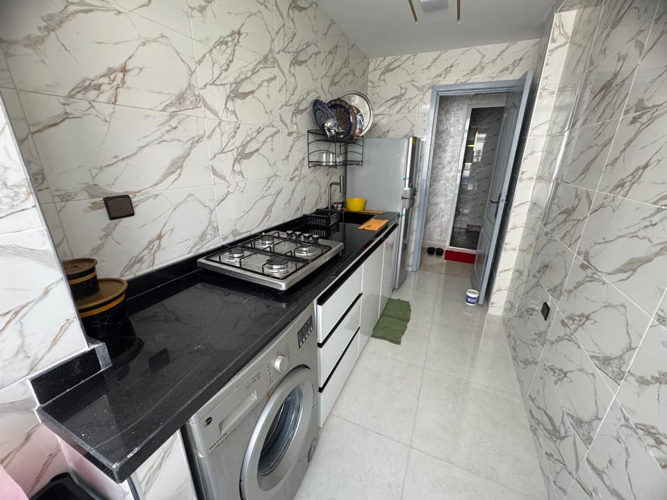 Kitchen or kitchenette, stove, washing machine