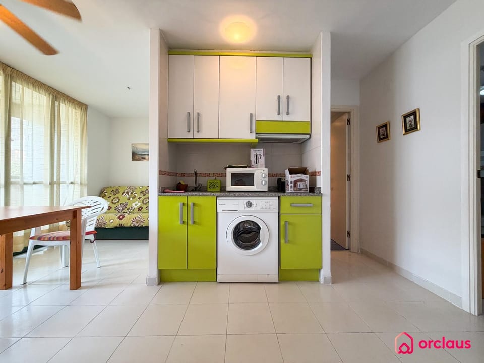 Kitchen or kitchenette, washing machine