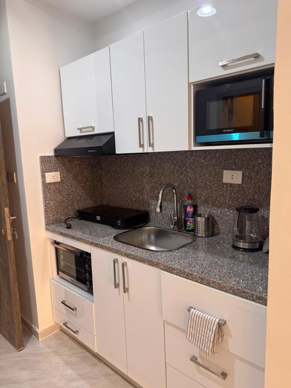 Kitchen or kitchenette, stove