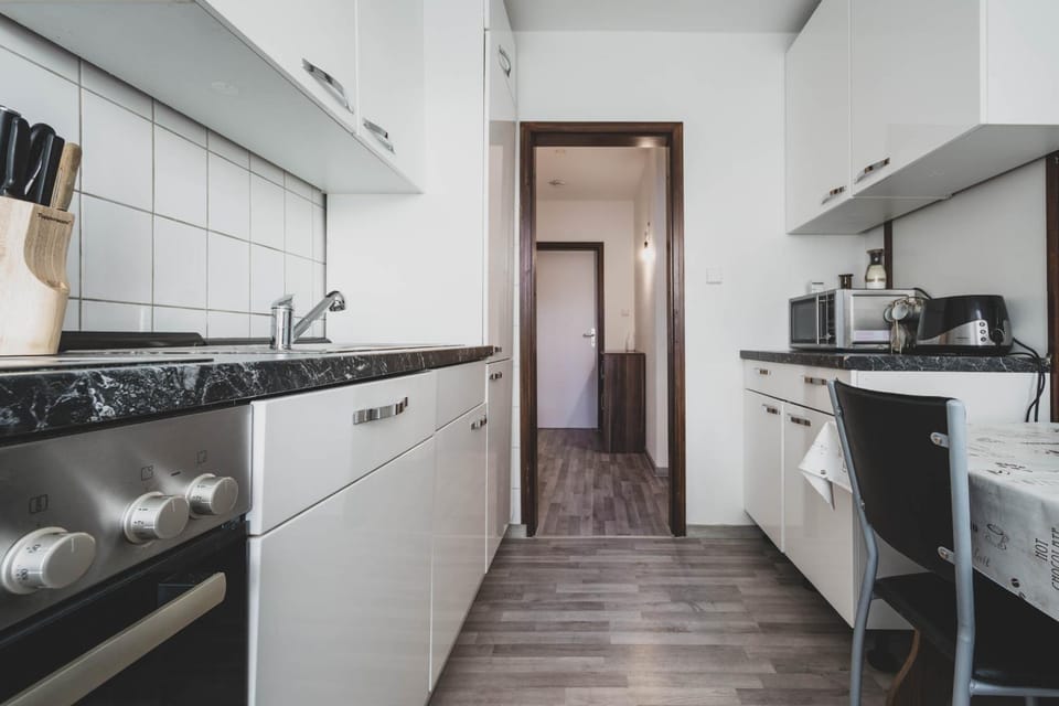 Kitchen or kitchenette, dishwasher, oven, stove, toaster
