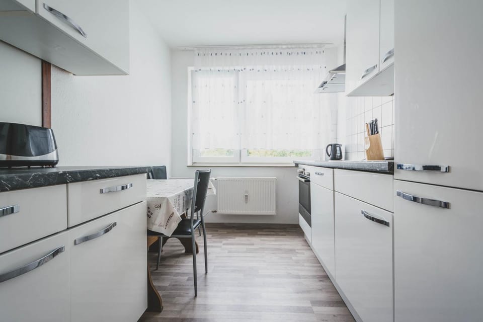 Kitchen or kitchenette, dishwasher, oven, stove, toaster