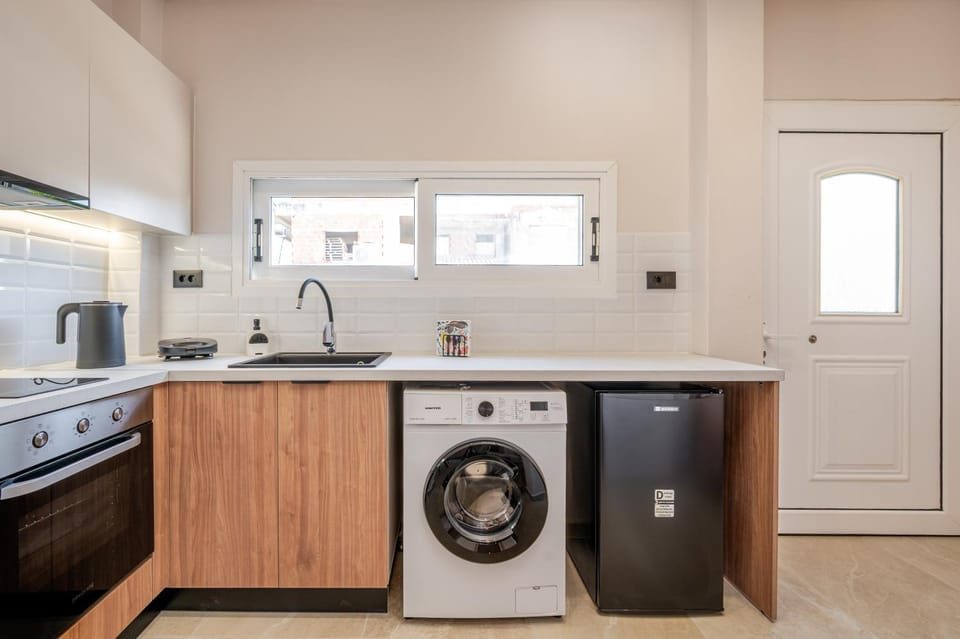 Kitchen or kitchenette, oven, stove, toaster, washing machine