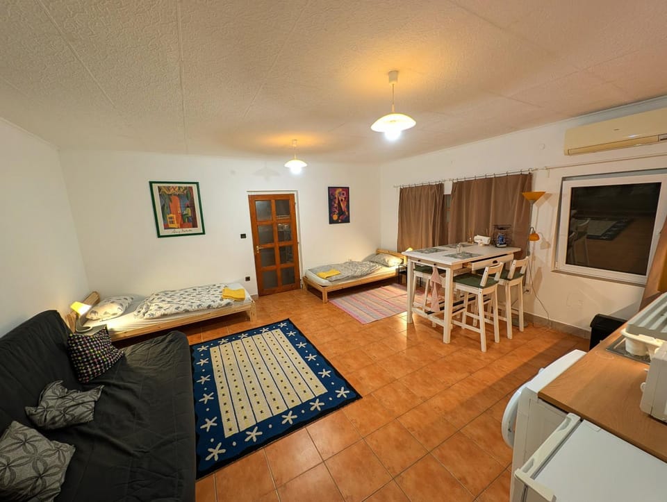 Bed, Living room, Seating area, Dining area