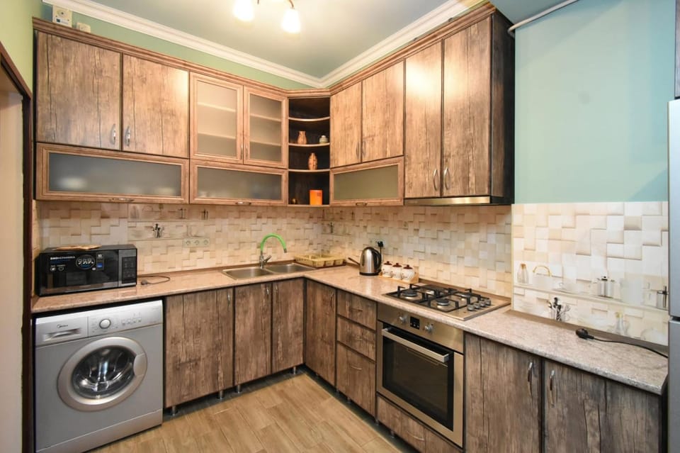 Kitchen or kitchenette, oven, stove, washing machine, dryer