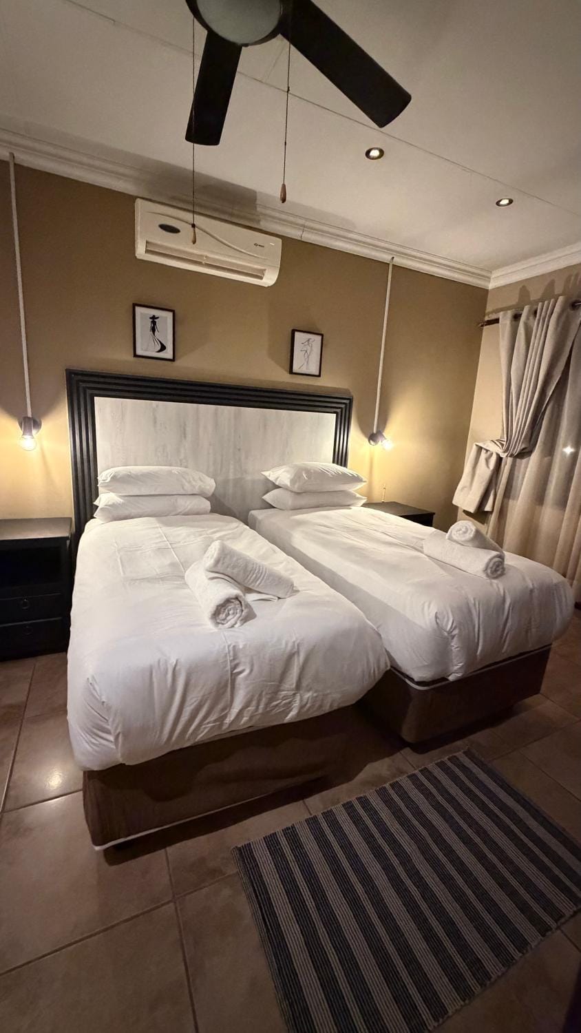 Bed, Photo of the whole room, Bedroom, towels, air conditioner