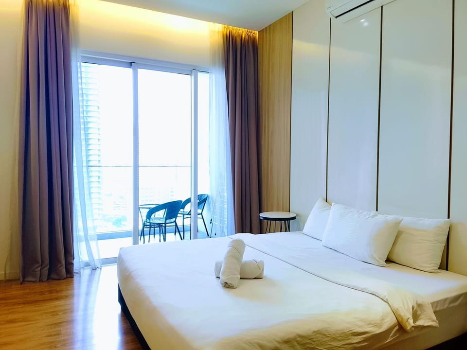 Bed, towels, wardrobe