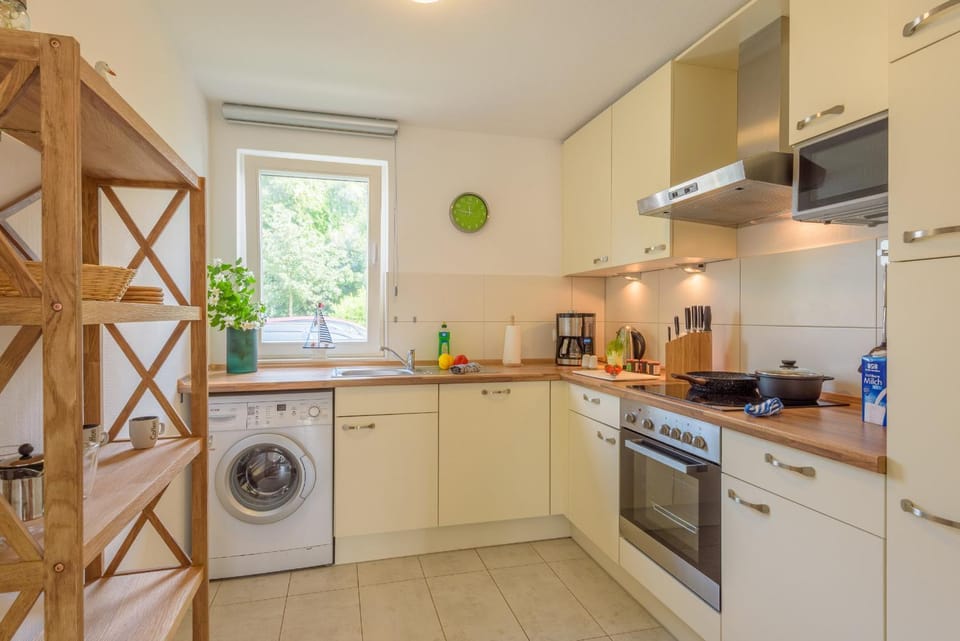 Kitchen or kitchenette, stove, toaster, washing machine