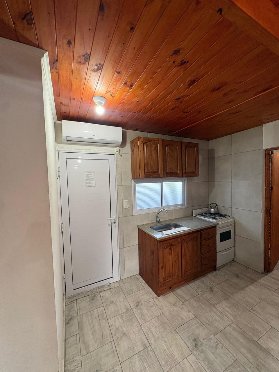 Kitchen or kitchenette, furniture, heating, oven, stove, air conditioner
