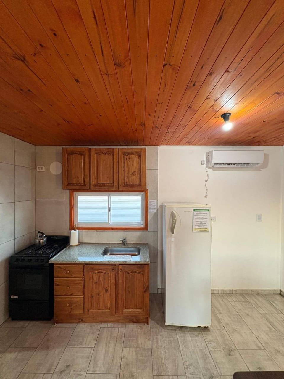 Kitchen or kitchenette, furniture, heating, oven, stove, air conditioner