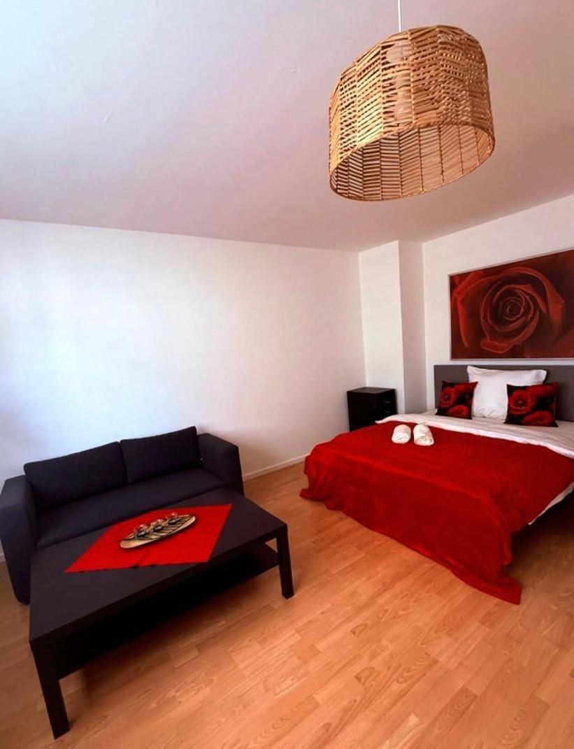 Bed, Living room, Seating area, Bedroom