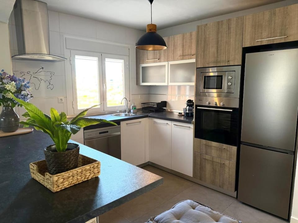 Kitchen or kitchenette, dishwasher, oven, stove, toaster