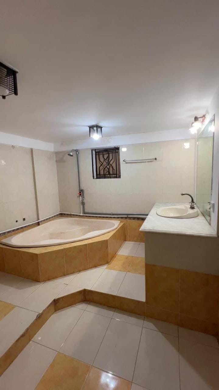 Spacious AC Bedroom with Wardrobe and Bathtub Apartment in Karachi