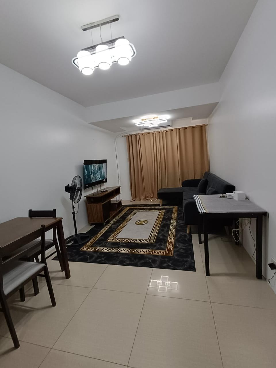 Spacious living room & big balcony - Pool View Apartment in Pasay
