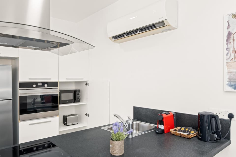 Kitchen or kitchenette, oven, stove, toaster
