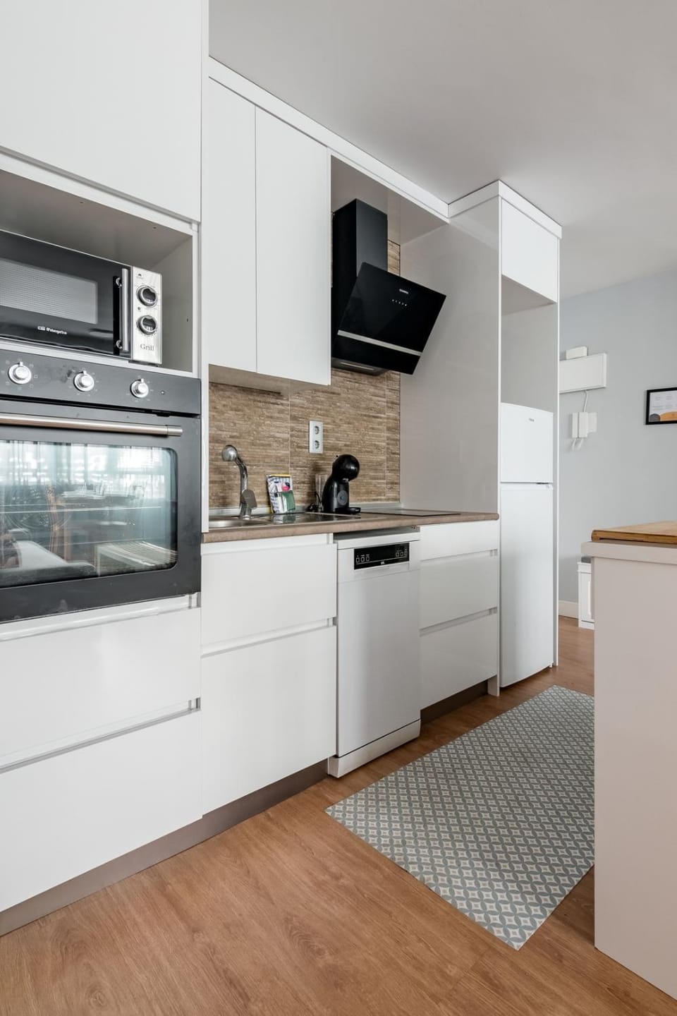 Kitchen or kitchenette, dishwasher, oven, stove, toaster