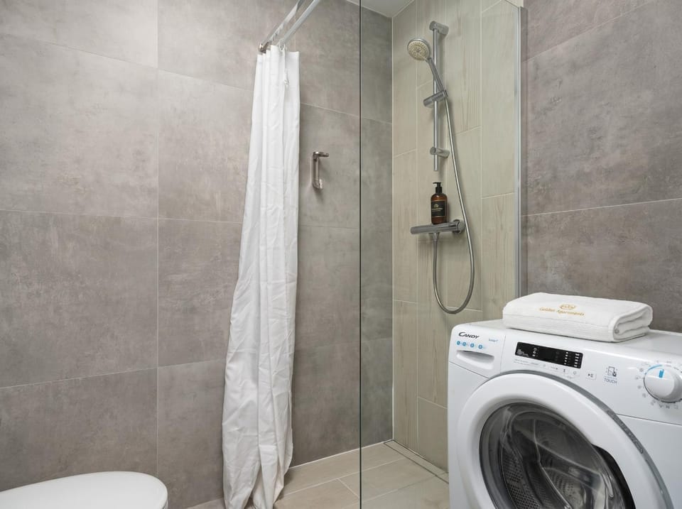 Shower, Toilet, Bathroom, towels, washing machine, dryer